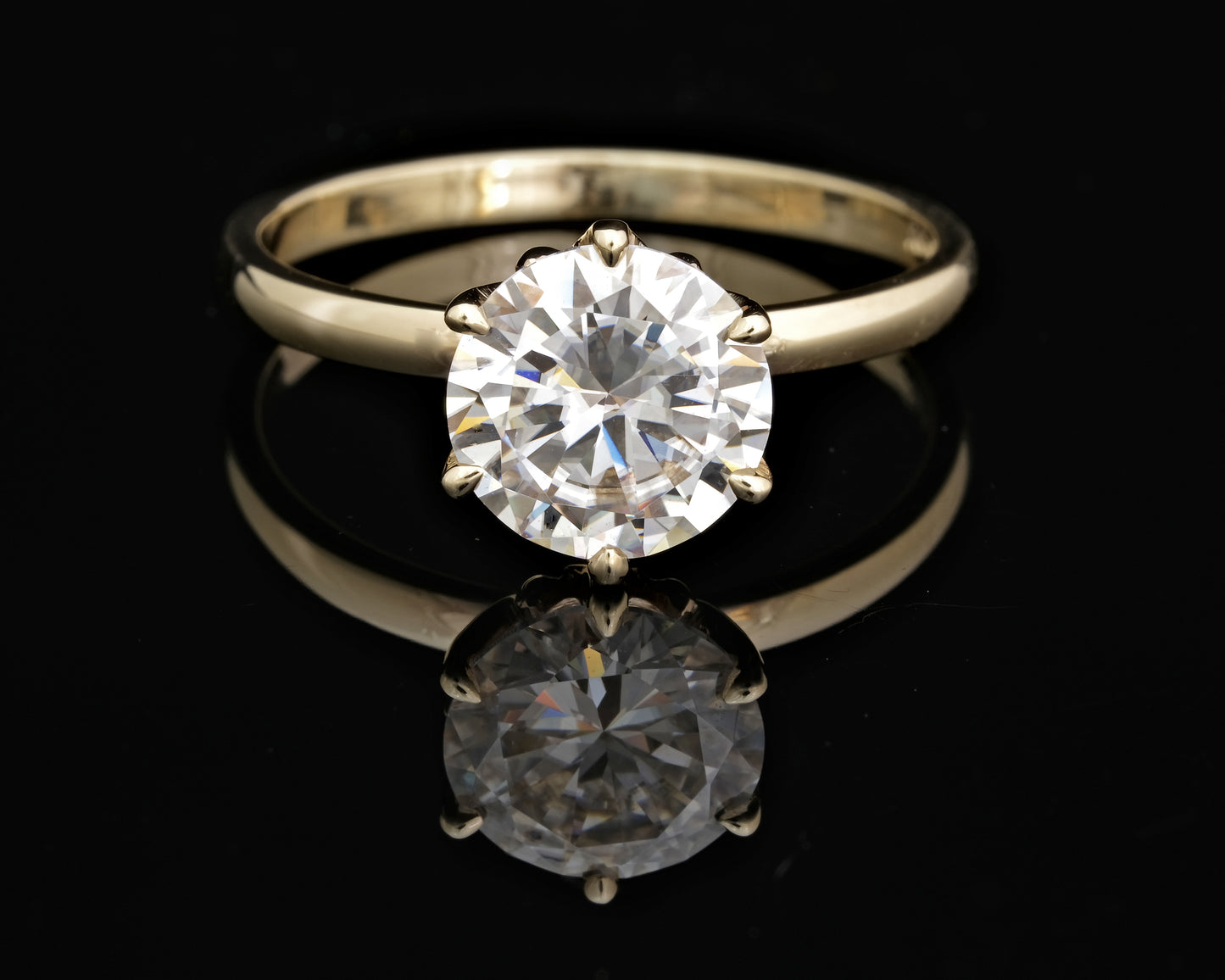 Gold and Moissanite Solitaire Ring