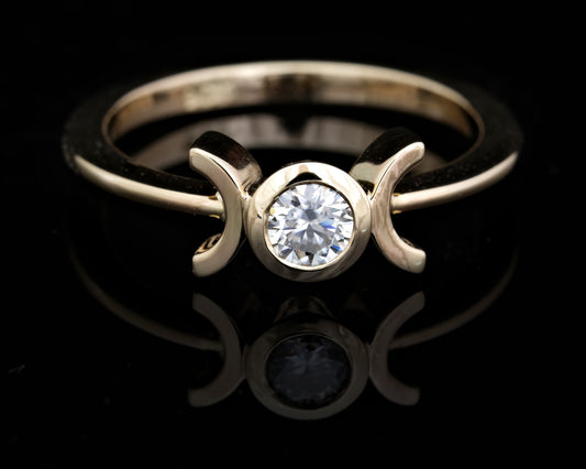 Moissanite and Gold Solitaire Ring