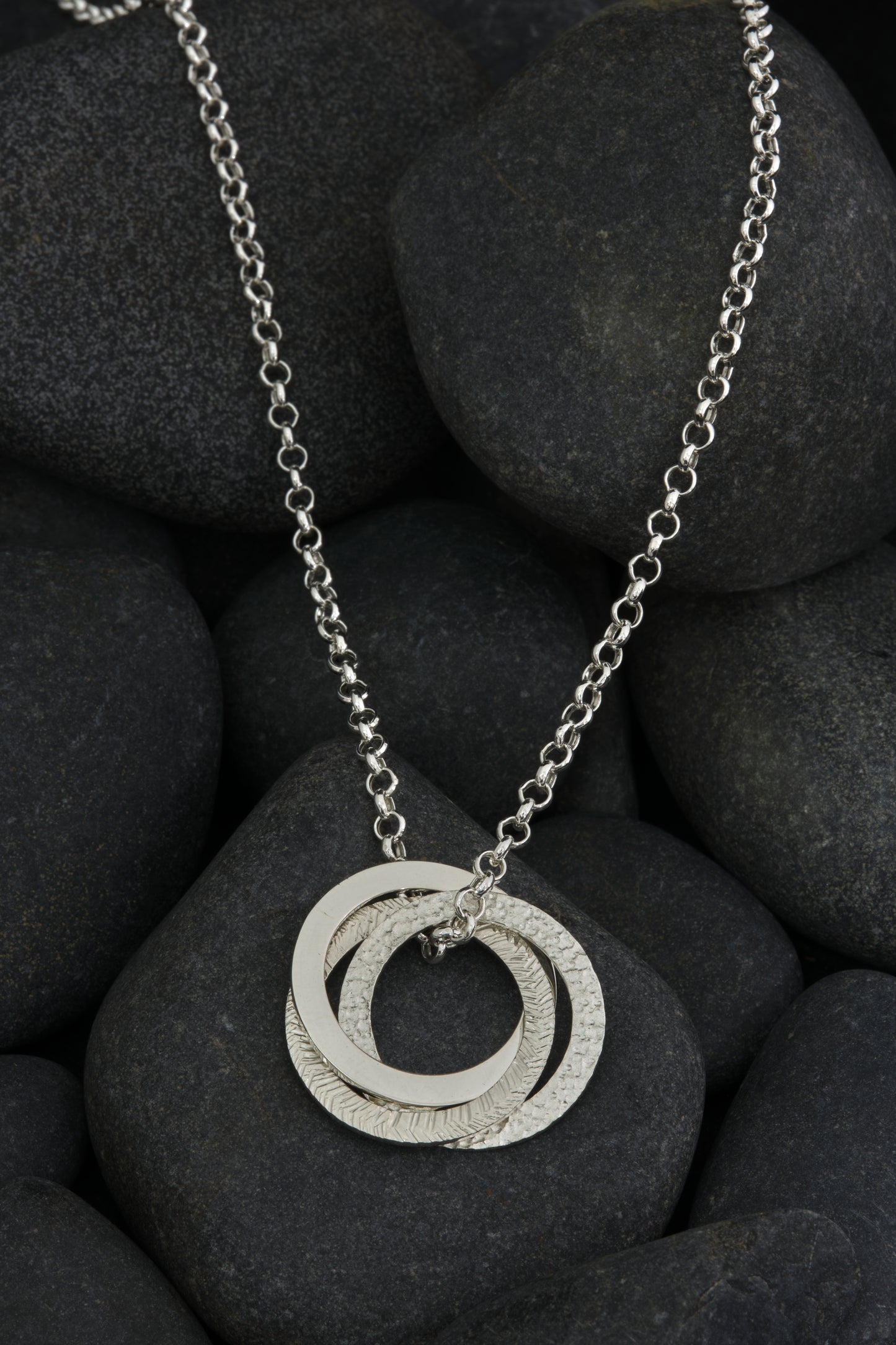 Silver textured, three ring pendant