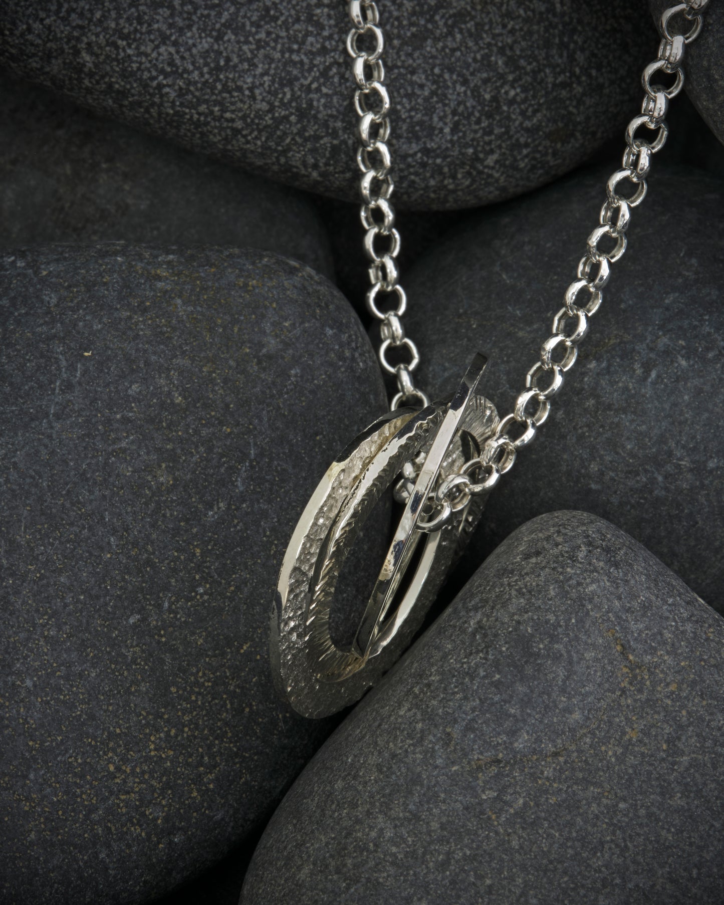 Silver textured, three ring pendant